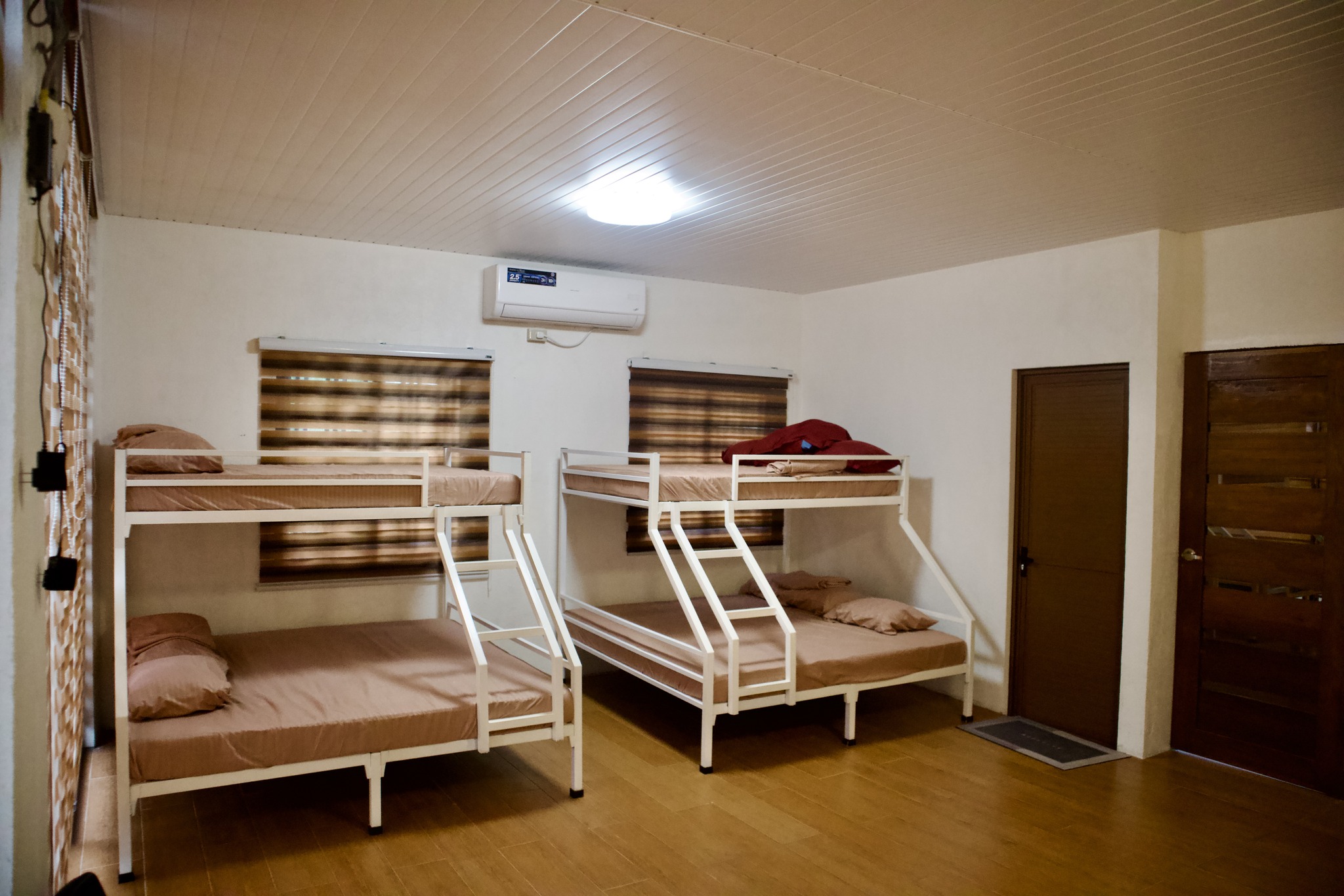 Wood-paneled deluxe room with queen bed